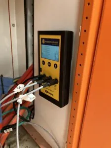 Energy and power data logger is attached to a switchboard and recording the power usage